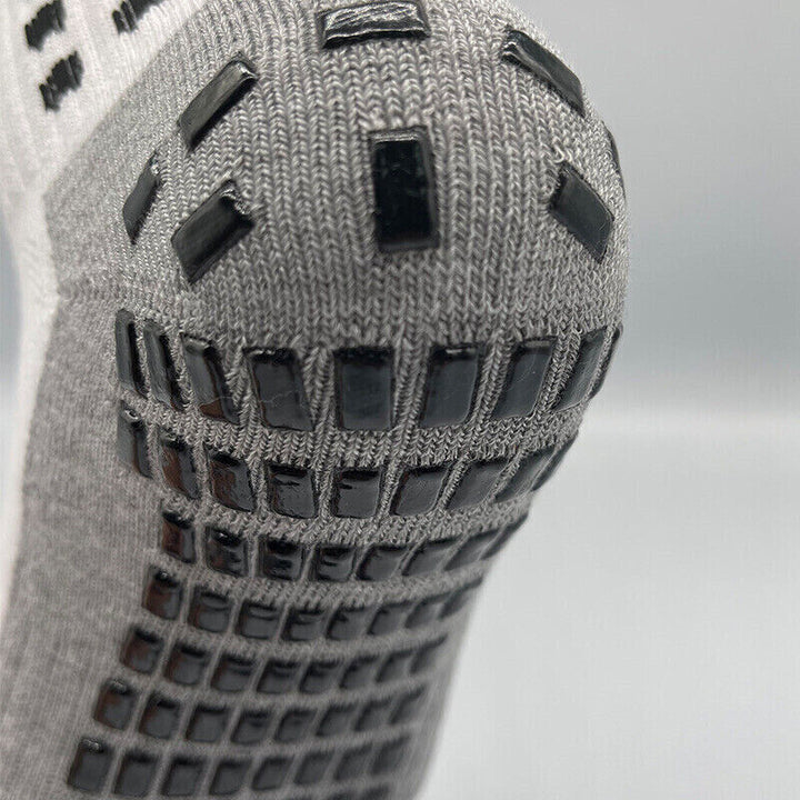 Durable activewear grip socks, mid-calf length, perfect for unisex athletes seeking anti-slip performance.
