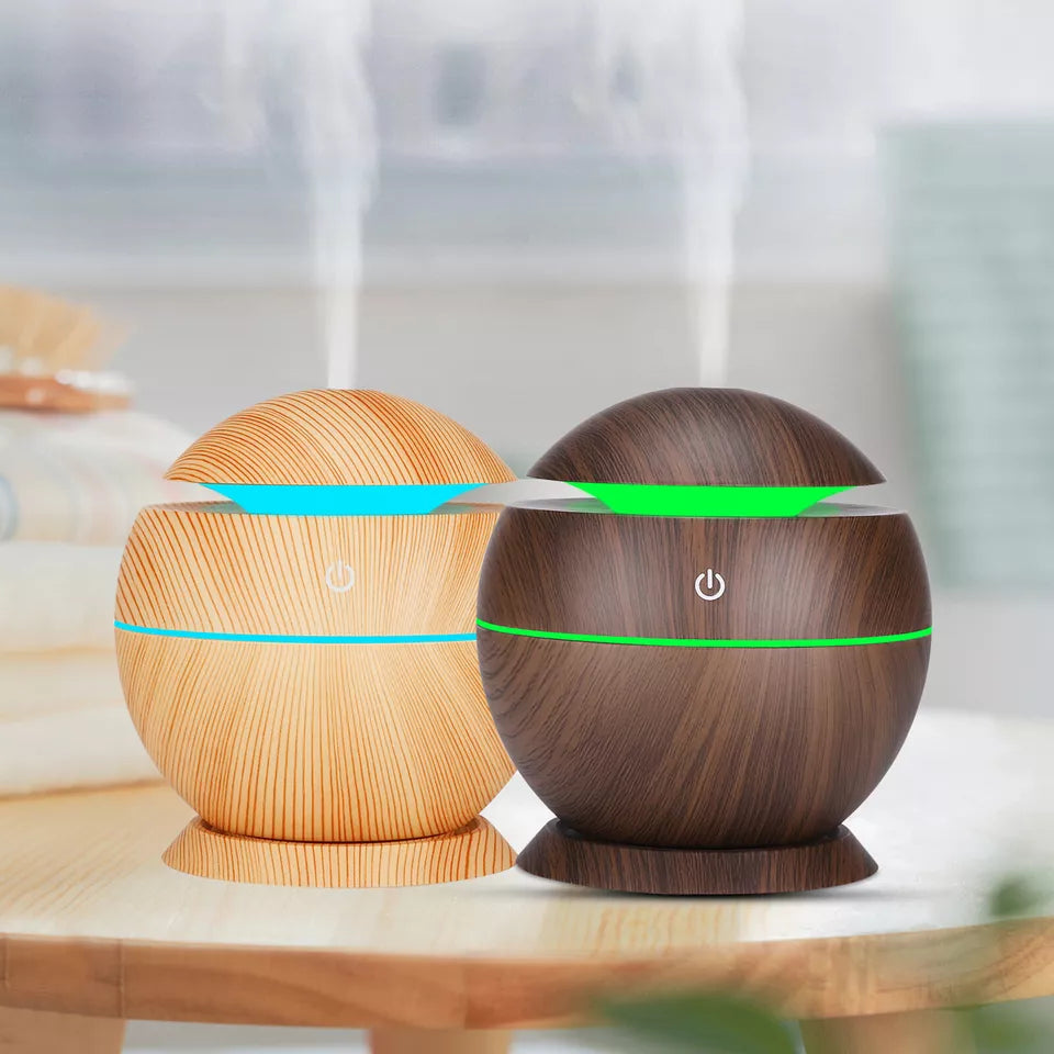Mini wood grain aromatherapy diffuser for essential oils, perfect for home & office relaxation.