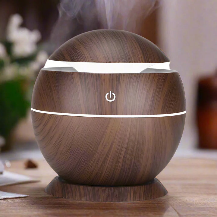 Mini wood grain diffuser, providing therapeutic essential oil benefits & a soothing mood light.