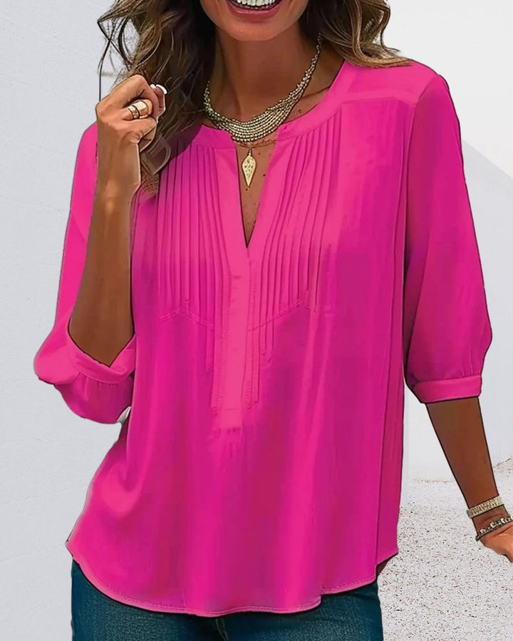 Versatile women's tunic top with stylish pleats & a modern split neck, ideal for spring/summer fashion.