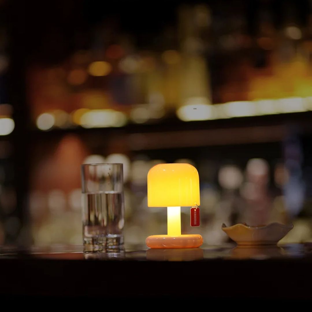 Small sunset lamp for ambient decor, projecting a beautiful, calming light effect.