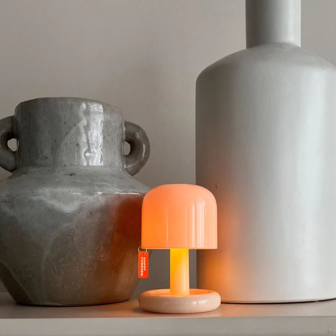 Mini sunset projector lamp, creating instant relaxing mood lighting and creative decor.