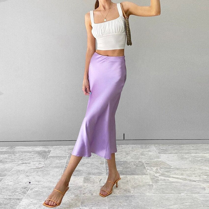 Close-up of the lustrous satin fabric of the high-waist A-line midi skirt. Shimmery & chic.