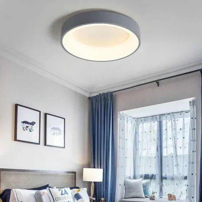 Minimalist Scandinavian style round LED ceiling lamp, a sleek fixture providing bright, energy-efficient home lighting.