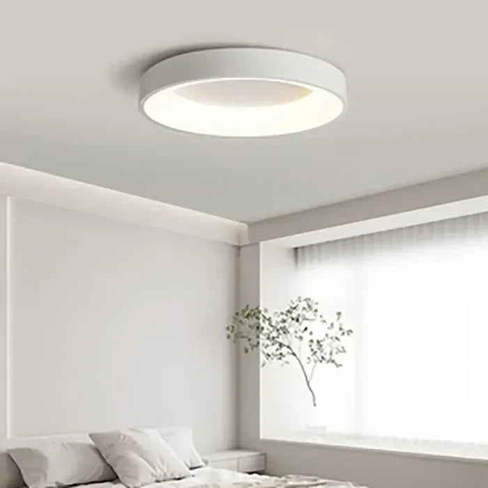 Sleek white round LED ceiling lamp, offering bright and even illumination for a modern Scandinavian-style home.