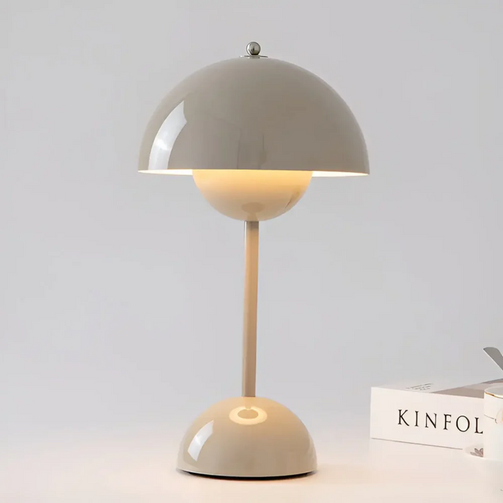 Sleek stainless steel modern LED table lamp, adds elegant decor to any room.