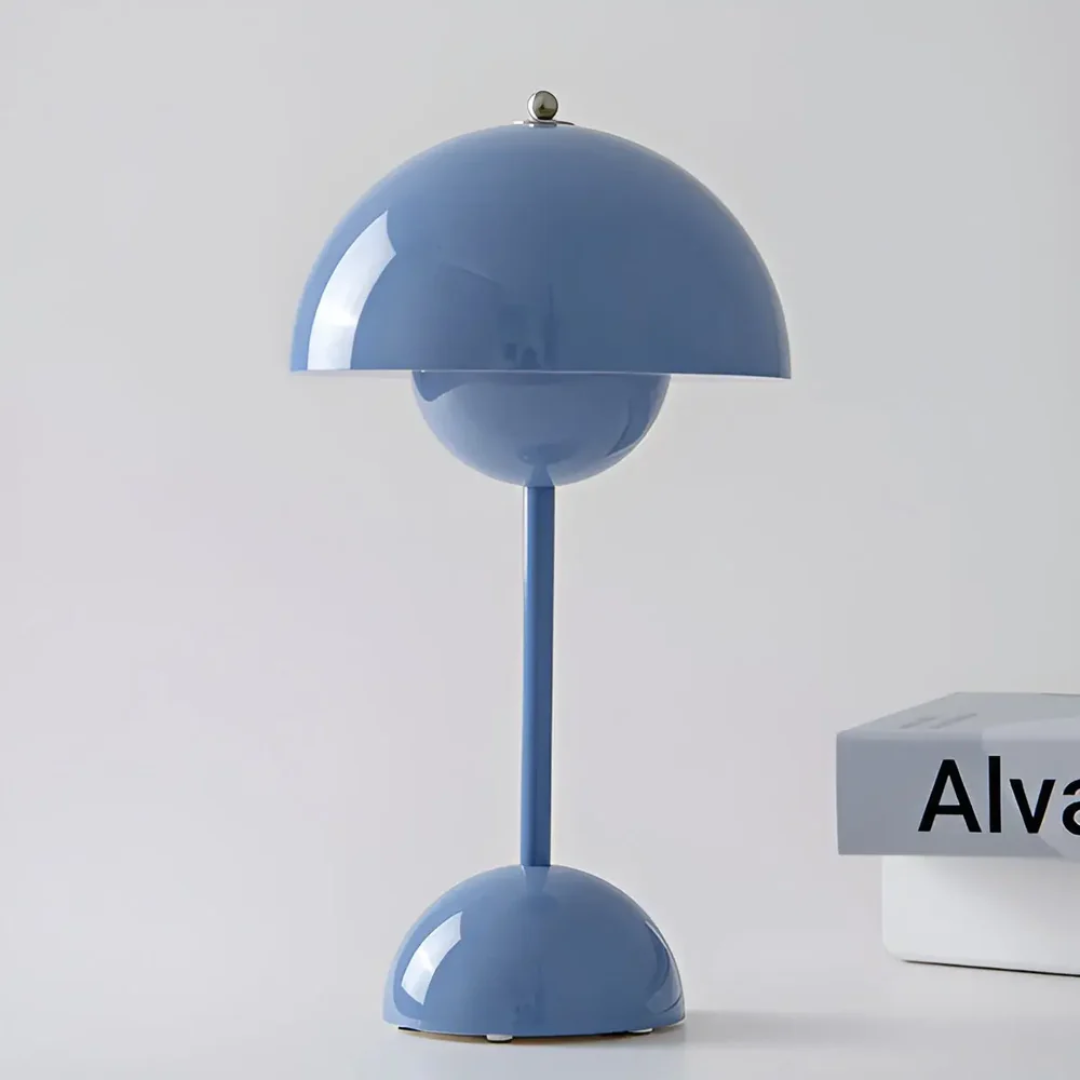 Dimmable wireless LED table lamp, creates ambient mood lighting for modern homes.