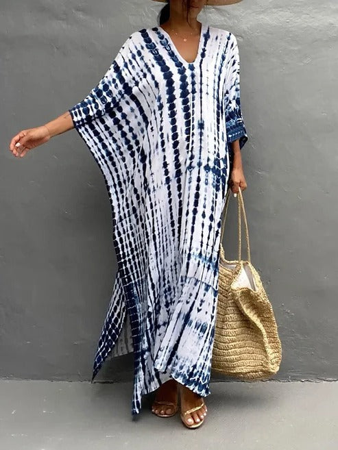 Vibrant tie-dye kaftan maxi dress, women's flowing beachwear perfect for summer days.