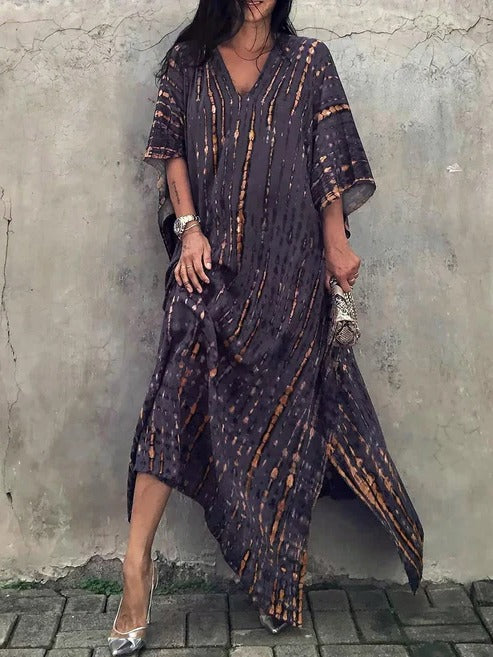 Full-length image of elegant tie-dye kaftan maxi beach dress, front view, chic & flowing.