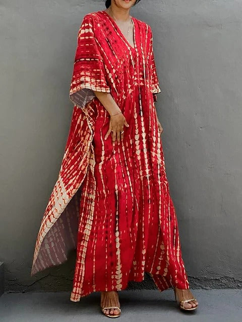 Close-up: Intricate tie-dye pattern on a flowing kaftan maxi dress, ideal summer style.