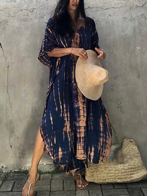 Bohemian flowing tie-dye kaftan maxi dress, elegant women's resort wear for tropical trips.