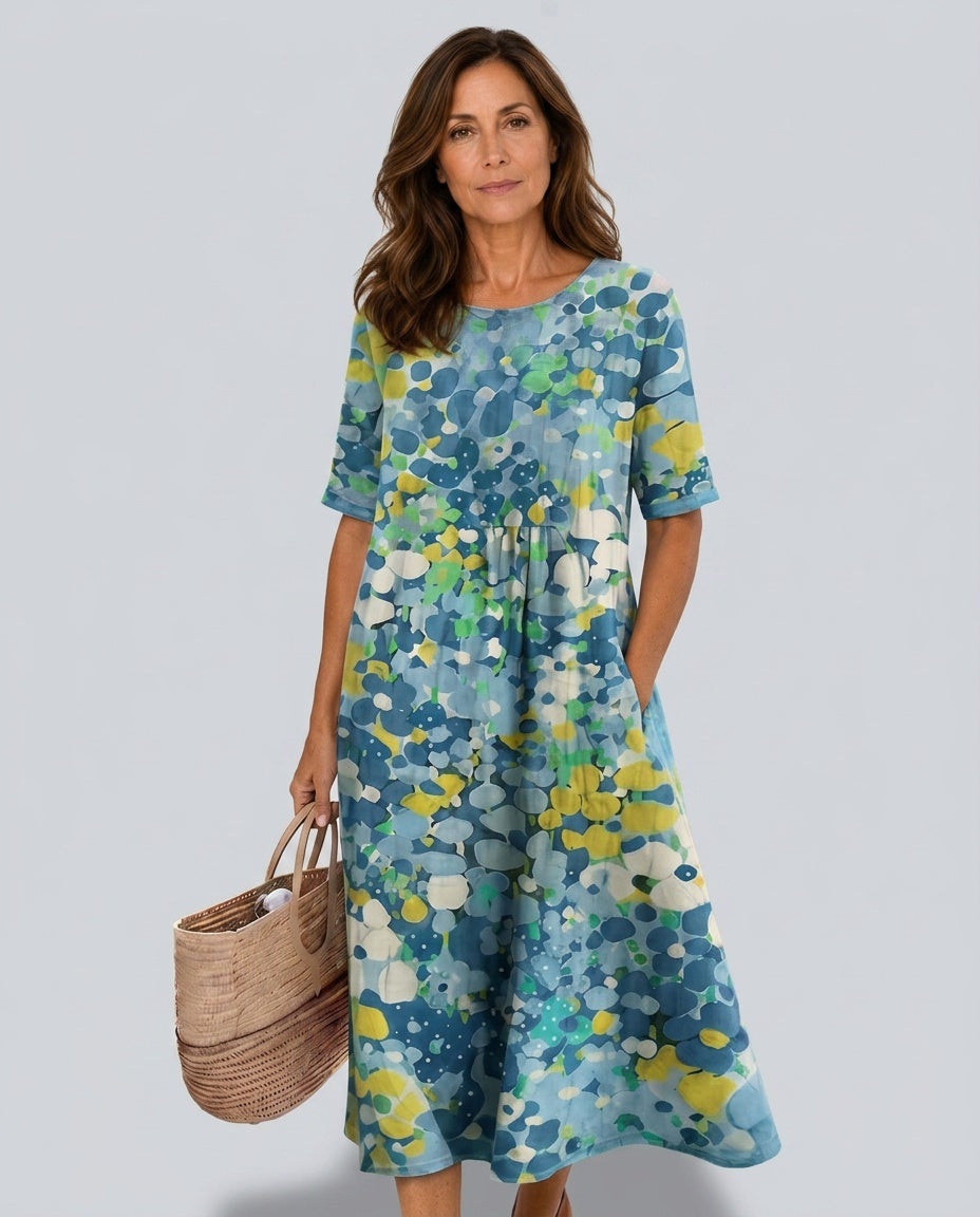 Elegant women's casual midi dress featuring an abstract floral design.