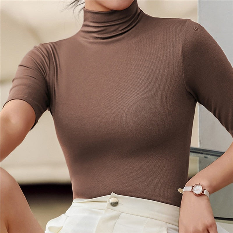 Figure-hugging women's seamless roll neck top, crafted for ultimate comfort & a smooth, flattering silhouette.