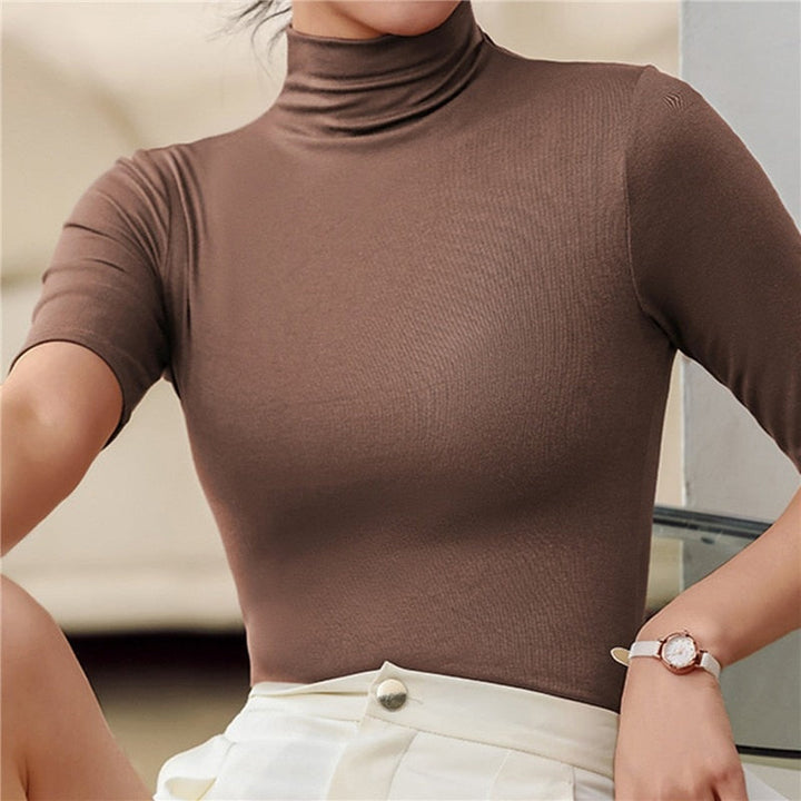 Figure-hugging women's seamless roll neck top, crafted for ultimate comfort & a smooth, flattering silhouette.