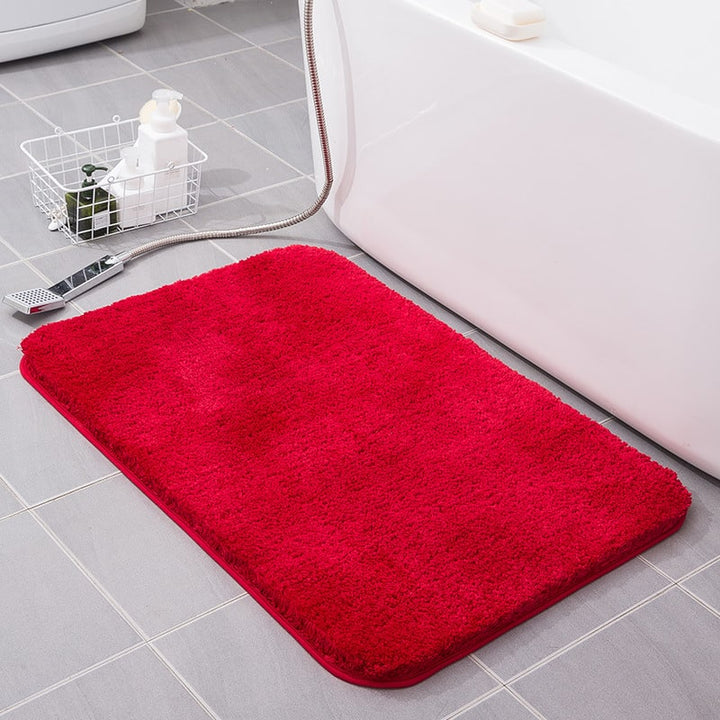 Quick-dry non-slip shaggy bath mat, absorbent microfiber for a cozy bathroom floor.