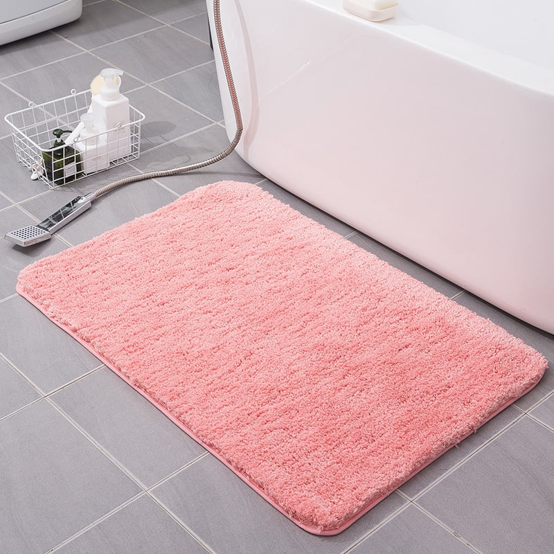 Rectangular shaggy microfiber bath mat, quick-drying and non-slip for modern bathrooms.