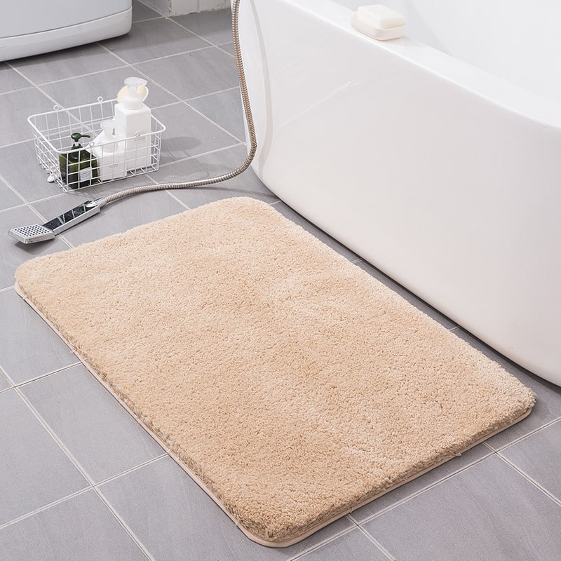 High-quality shaggy microfiber bath mat, quick-dry, non-slip, absorbent bathroom floor accessory.
