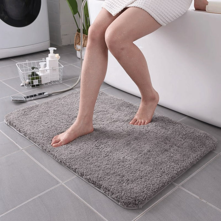 Comfortable quick-dry bathroom rug, a soft shaggy microfiber floor mat with non-slip backing.