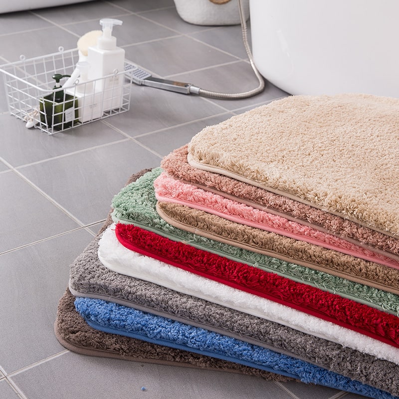 Luxurious plush shaggy microfiber bath mat, quick-dry and non-slip for shower safety.
