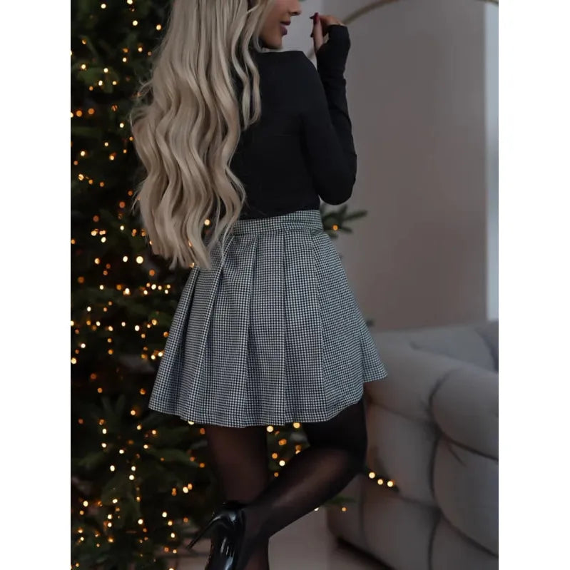 Chic women's plaid mini skirt, above-knee, featuring a classic checked pattern for versatile fashion looks.