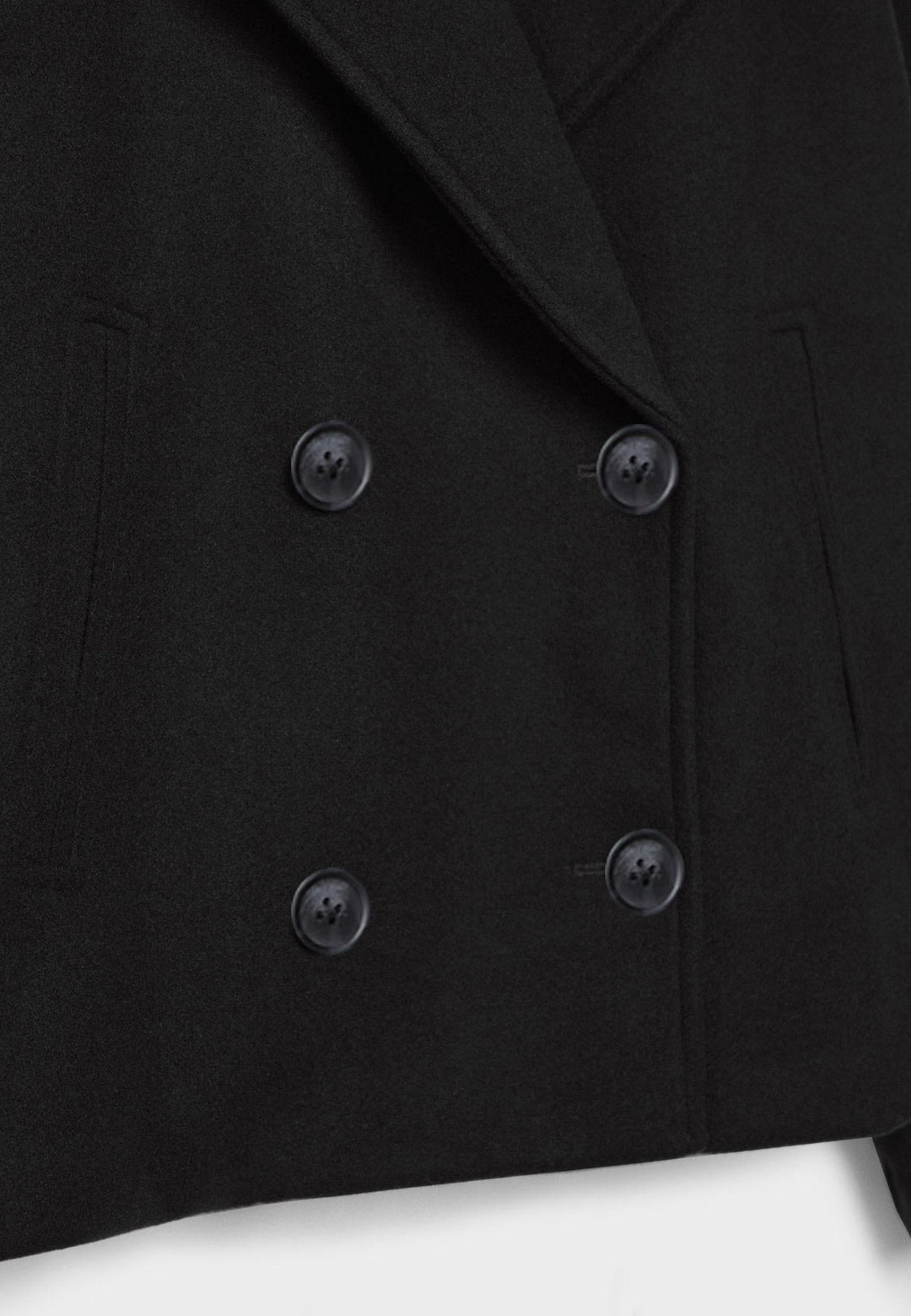 Tailored double-breasted crop jacket for women, exuding modern elegance and style.
