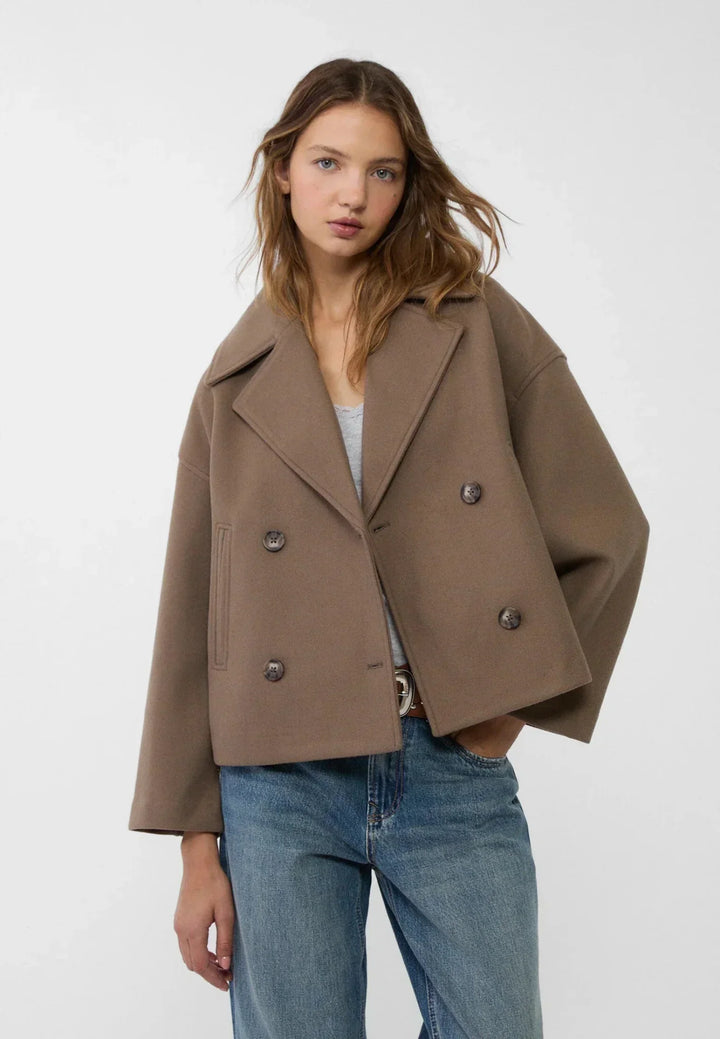 Stylish women's tailored crop coat, double-breasted, for a sharp and contemporary ensemble.