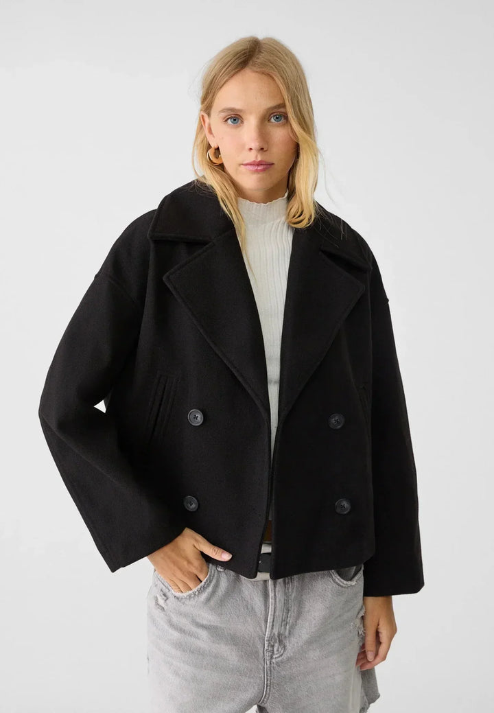 Professional women's double-breasted crop coat, offering a sleek and elegant silhouette.