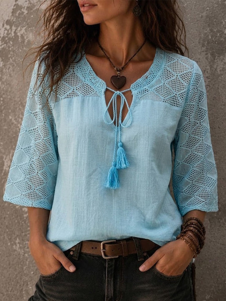 Women's elegant white boho V-neck tunic top with delicate crochet trim & 3/4 sleeves, perfect for summer casual.