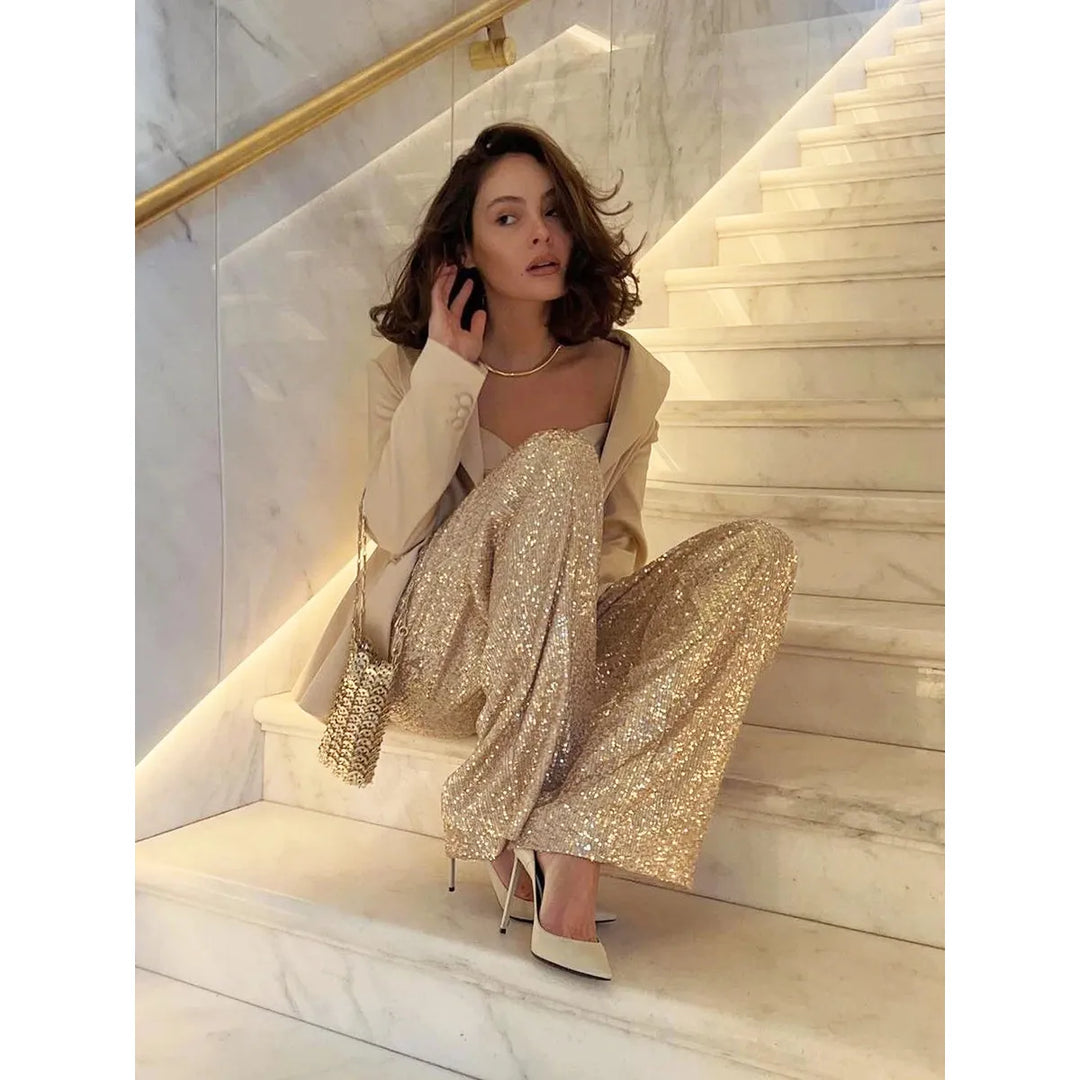 Women's festive silver sequin trousers, dazzling and luxurious for evening partywear.