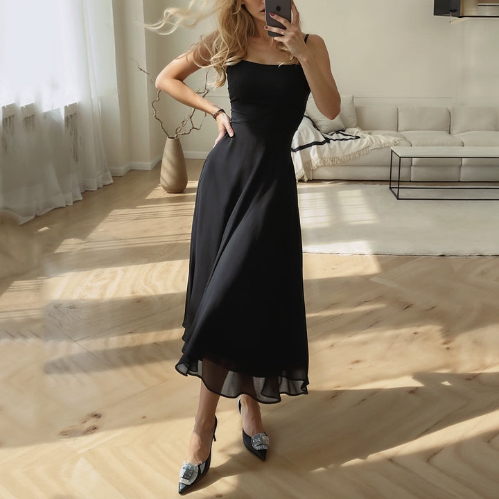 Stylish women's sleeveless midi dress. Airy fabric and flattering fit make it a versatile summer fashion essential.