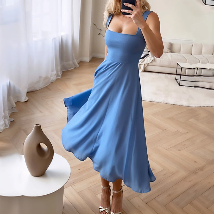 Elegant women's sleeveless airy midi travel dress. Flattering fit for comfortable summer adventures.