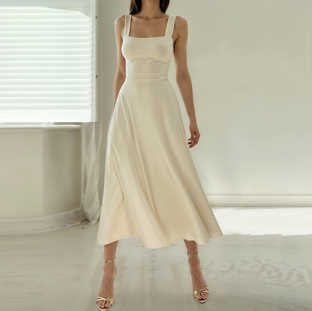 Women's sleeveless airy midi dress with a flattering fit, perfect for summer casual or elegant wear.