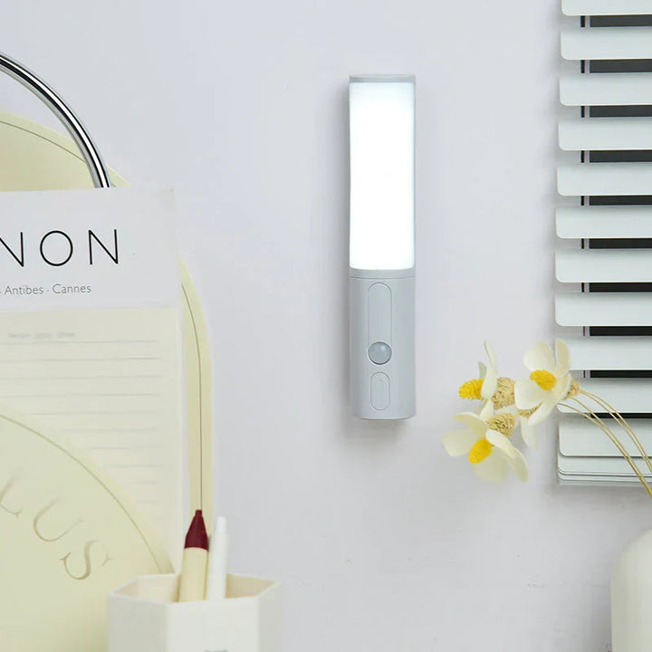 Slim Lumos LED night light with motion sensor, perfect for bedrooms & hallways.