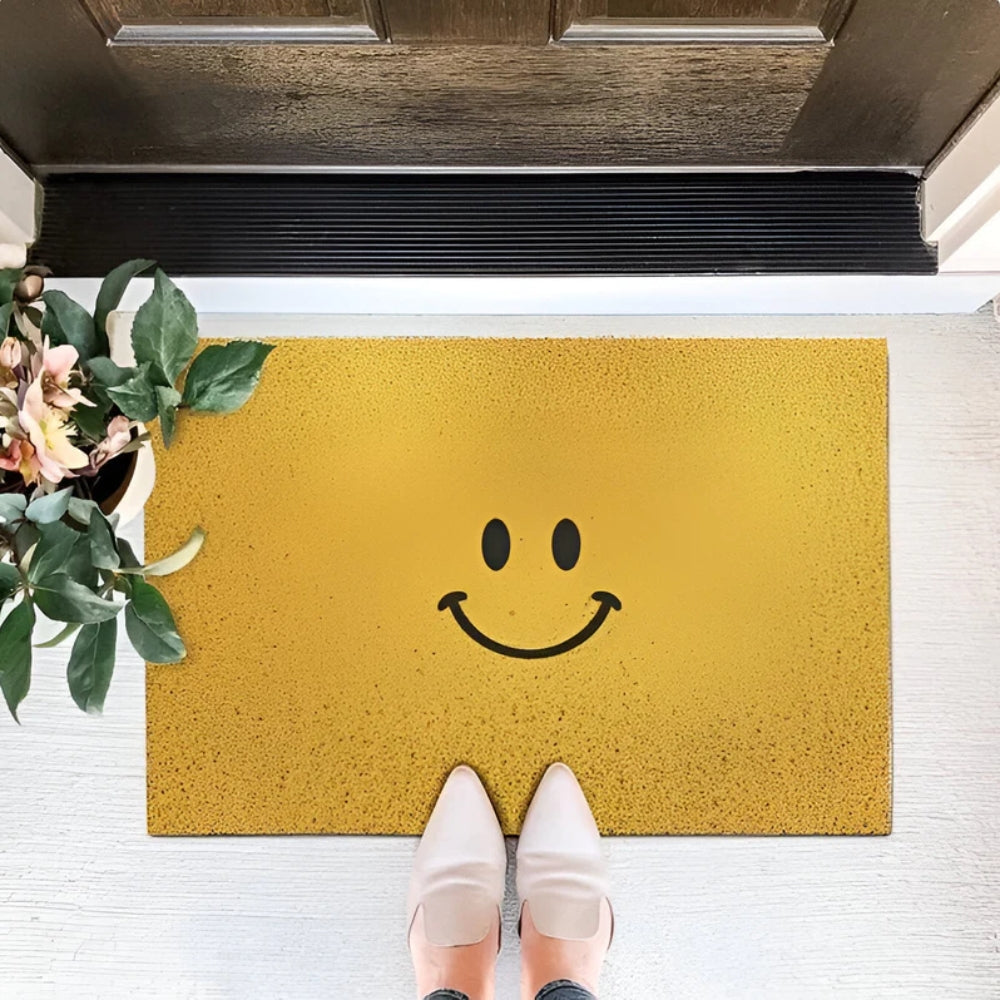 Unisex smiley face non-slip doormat. A durable, cheerful floor mat for indoor and outdoor entrances.