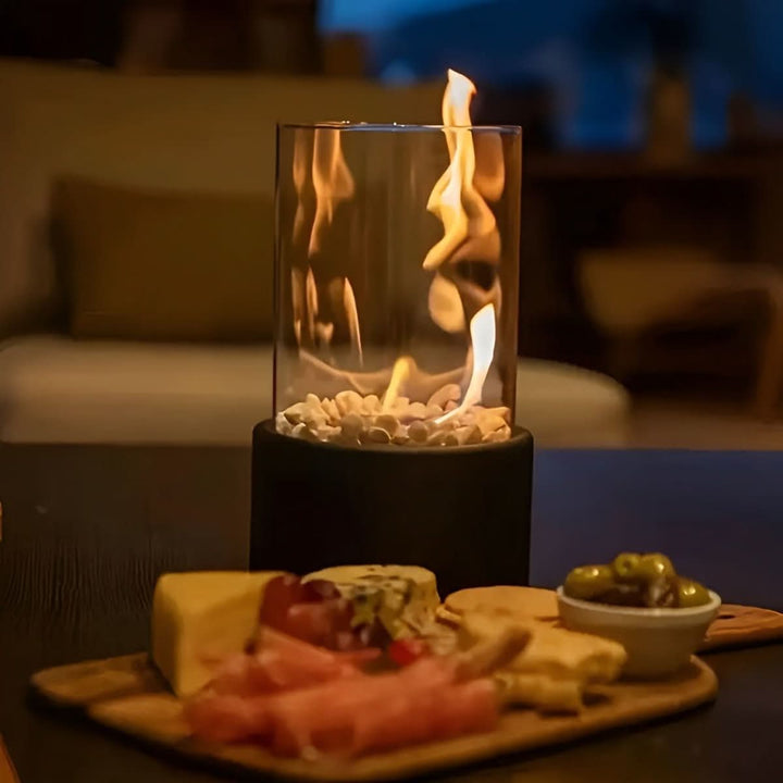 Outdoor portable bioethanol table fireplace providing warm, smoke-free ambiance for patios & decks.