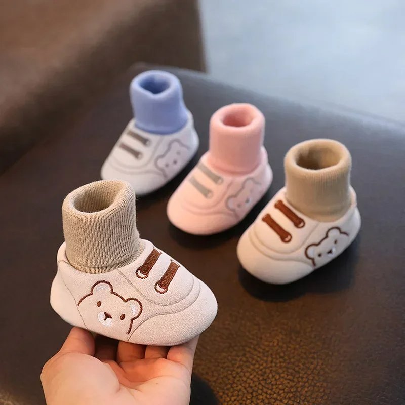 Cozy baby winter booties with soft plush lining and non-slip sole, providing warmth & comfort for little feet.