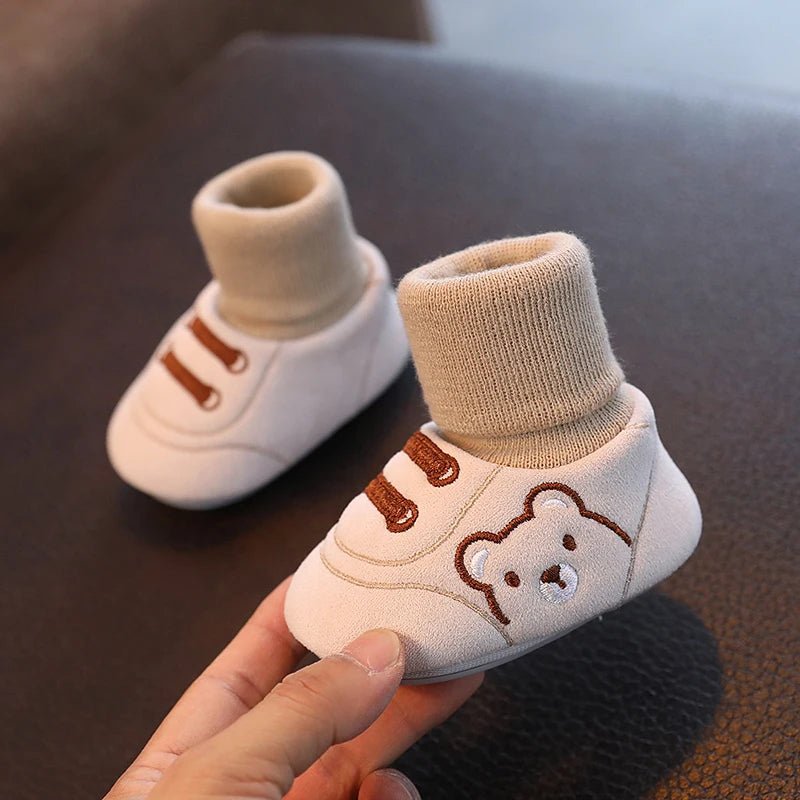 Non-slip baby winter booties, ensuring safety for infant's first steps with warm, comfortable plush lining.