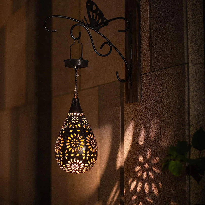 Eco-friendly LumaBright solar hanging lantern provides automatic outdoor lighting for garden decor & patio.