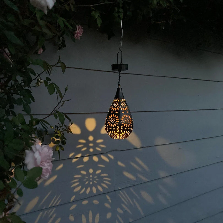 Outdoor hanging lantern by LumaBright. Solar-powered, eco-friendly patio & garden lighting solution.
