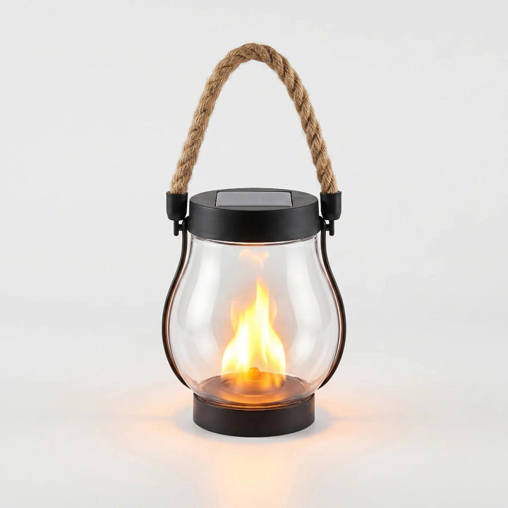 Bright LED solar outdoor light, featuring a hanging lantern design & flickering flame, perfect for pathways.