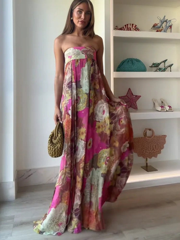 Sophisticated women's floral strapless maxi dress, ideal wedding guest attire & formal occasion wear.