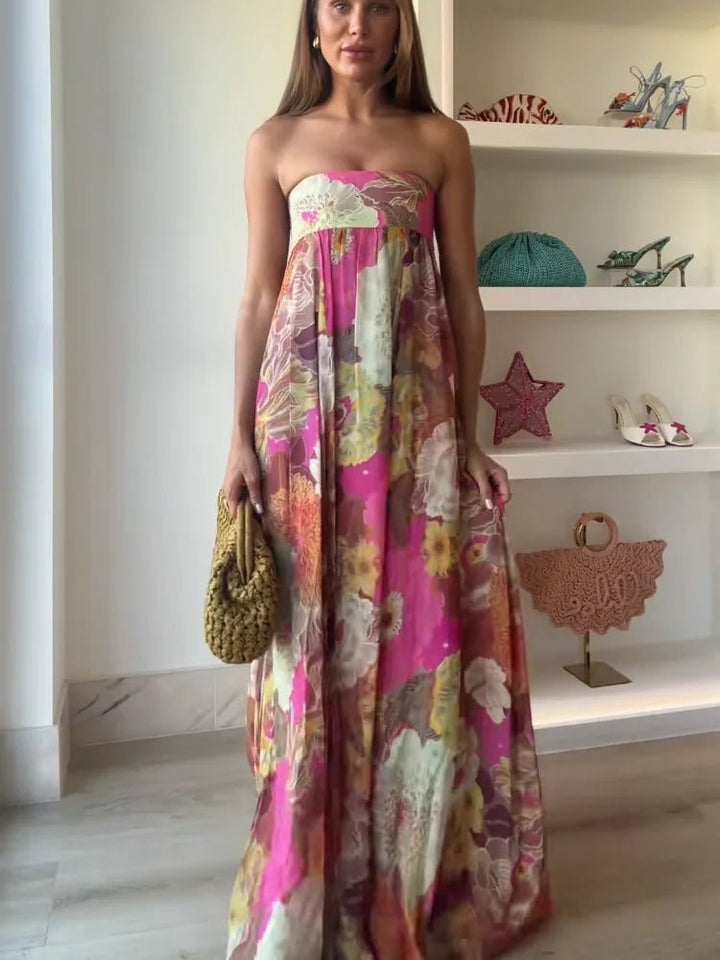 Beautiful women's strapless floral maxi dress with intricate print. A stunning cocktail or evening party gown.
