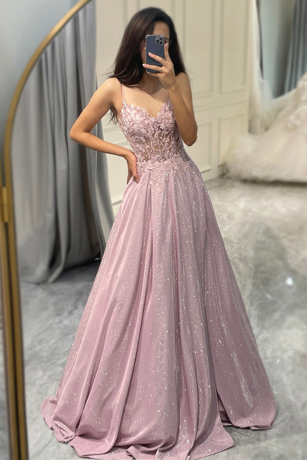 Clara sparkling blush A-line ball gown. Floor-length formal dress for bridesmaids or galas, V-neck spaghetti straps.
