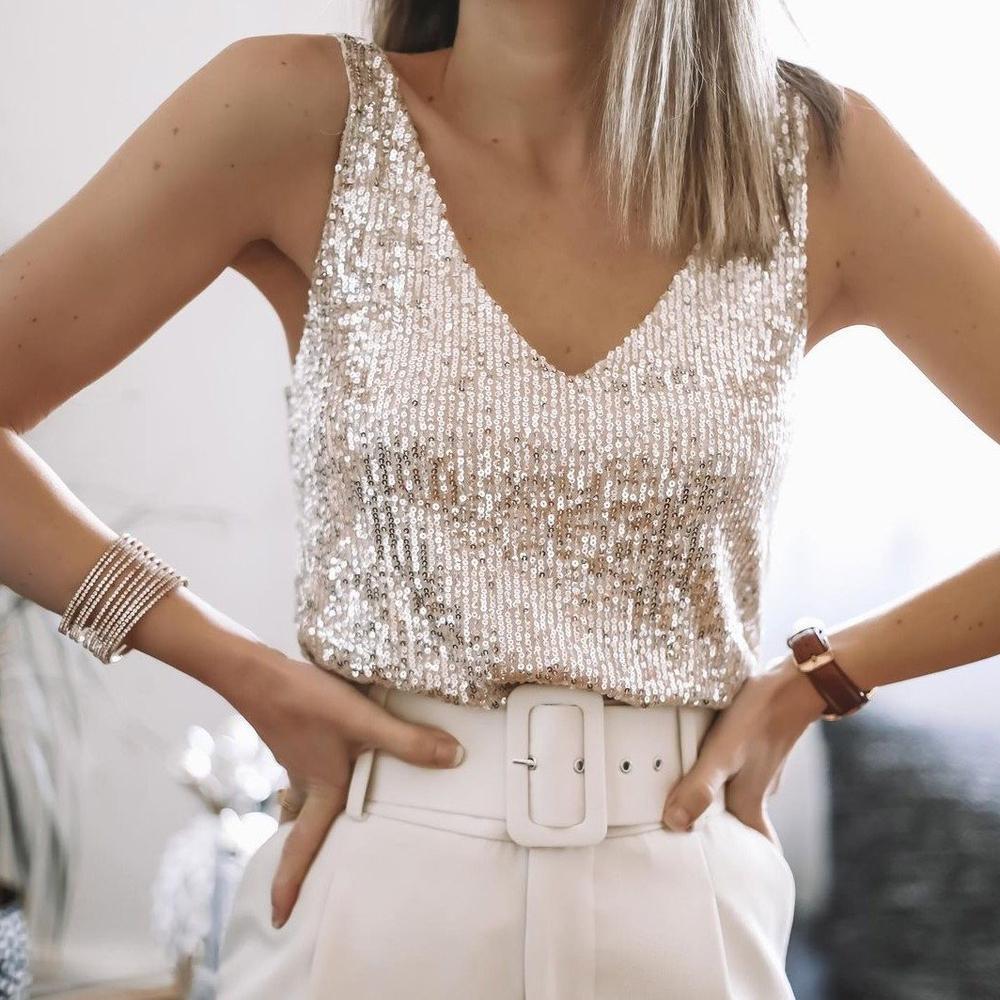 Sparkling women's beige sequin party top with spaghetti straps. A festive and glamorous evening wear essential.