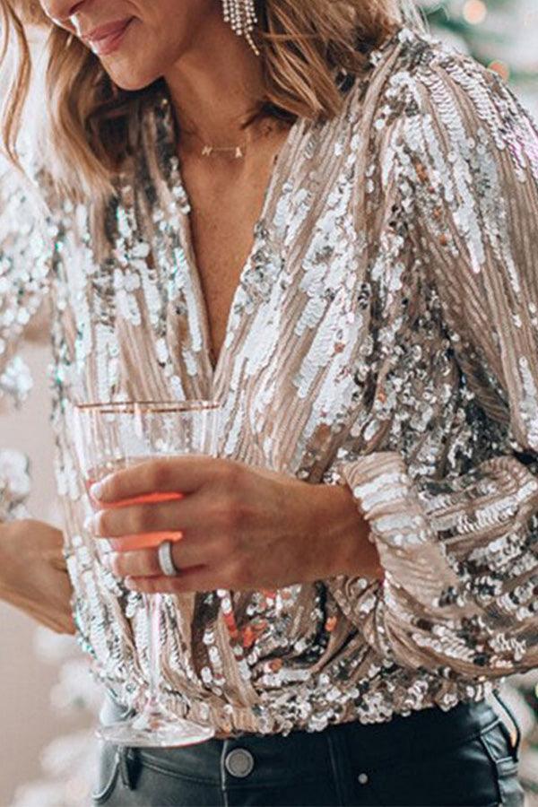 Glamour women's V-neck long sleeve top with sparkling glitter. A stylish shimmer shirt for evening fashion.