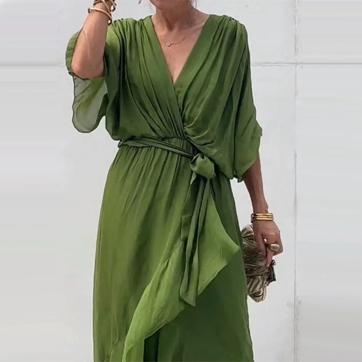 Elegant plus-size V-neck midi dress in a flowy fabric, women's half-sleeve design, suitable for all occasions.