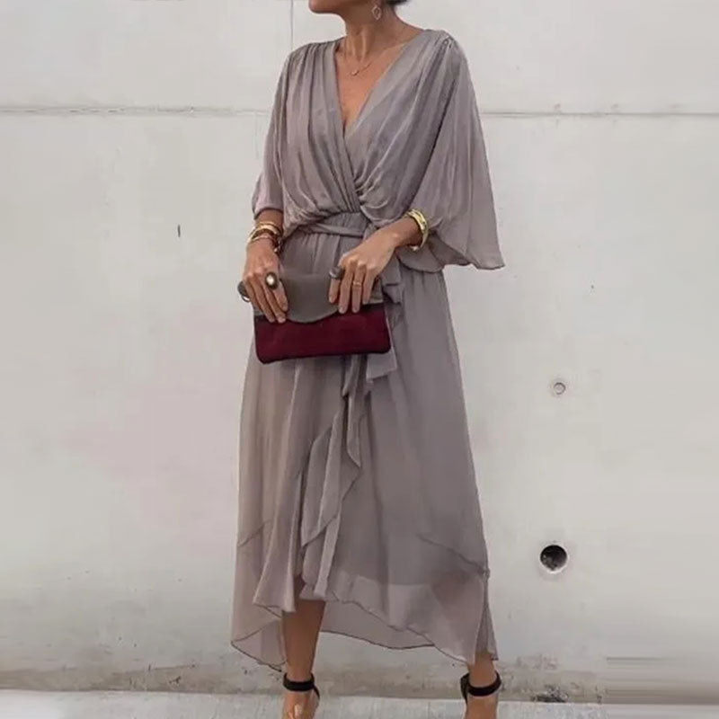 Stylish half-sleeve plus-size flowy V-neck midi dress for women, elegant design, suitable for both casual & formal.
