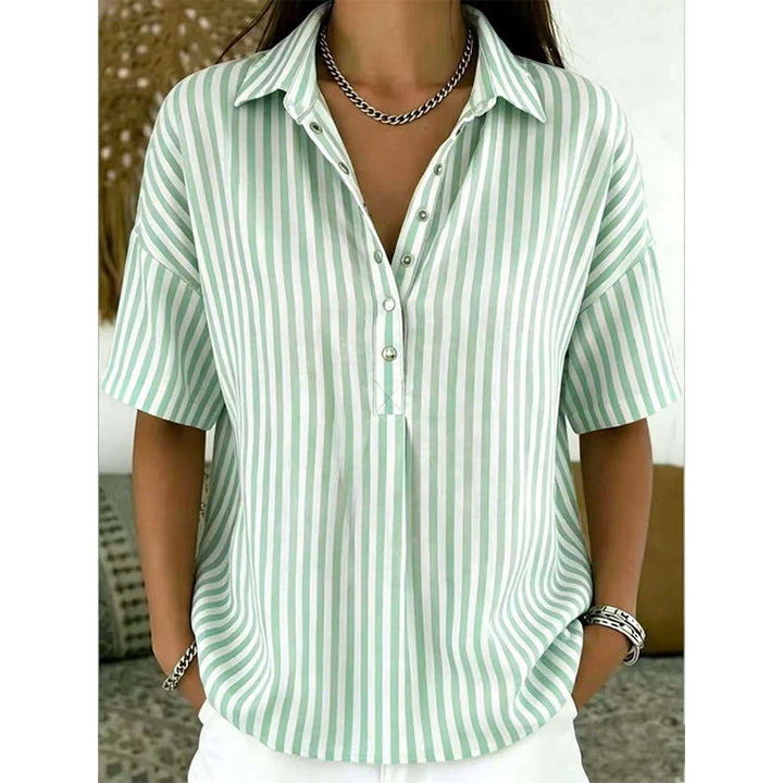 Woman showcasing a versatile striped V-neck short-sleeve shirt for chic summer fashion.