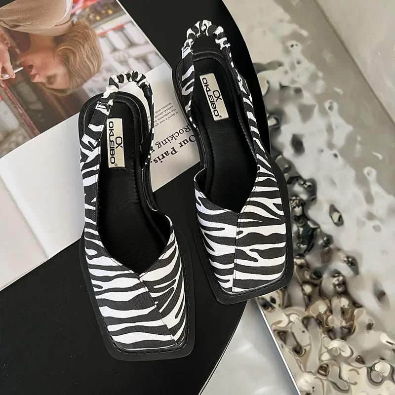 Comfortable slip-on square-toe slingback flats for women, offering effortless chic footwear.