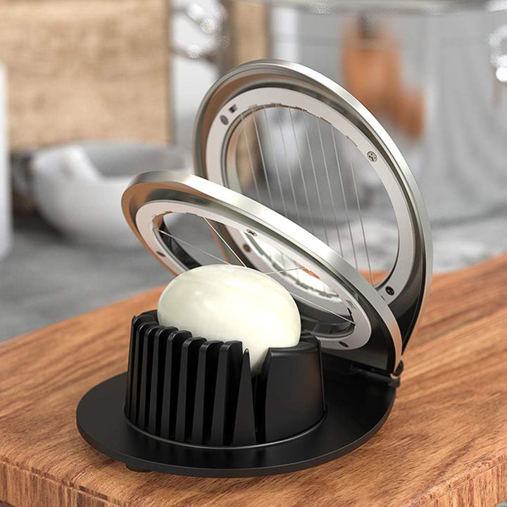 Stainless steel egg slicer for quick, easy, and precise slicing. Perfect kitchen gadget for food prep.